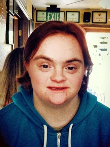 Alex, an adult who has Down syndrome and is a college student